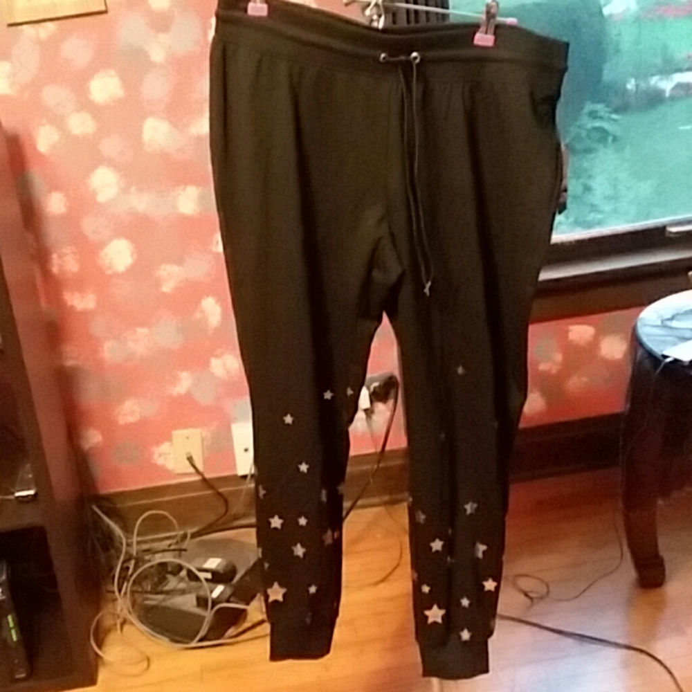 Black joggers with gold stars